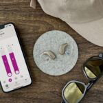 Oticon_Intent_Still_Life_miniRITE_iPhone_Sunglasses_Cap_MS_0237